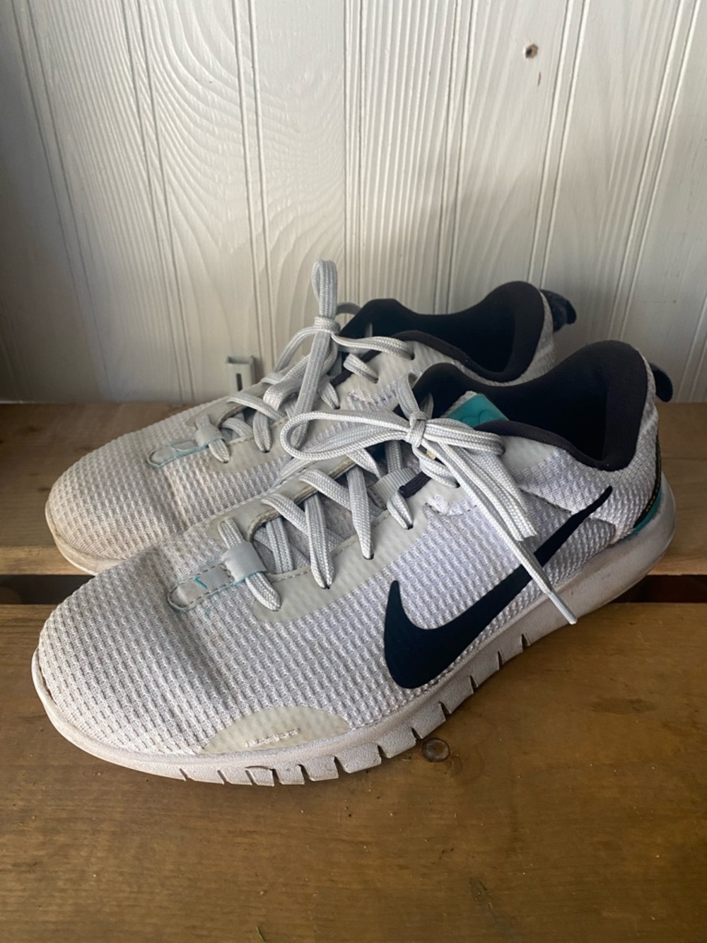 Nike Athletic Shoes with Black Swoosh and Teal Accents